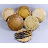 Six Turned and Carved Wood Bread Boards, Late Victorian, including one carved with wheat ears and