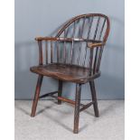 An 18th/19th Century Ash and Elm Seated Stick Back Windsor Armchair of primitive form, with low