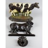 A Cast Iron And Painted Doorstop Of A Standing Cow, Early 20th Century, 8.75ins high, a cast iron