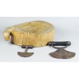 A Wooden One-Handled Chopping Bowl, and Two Choppers, 19th Century, the bowl carved with initials "