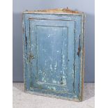 A 19th Century Blue Painted Pine Hanging Corner Cupboard, fitted two shelves enclosed by a single
