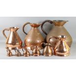 A Graduated Harlequin Set of Copper Measures, 19th Century, the largest 4 gallons, 14ins high, the