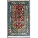 A Fine Isfahan Prayer Rug, Mid 20th Century, woven in colours of wine, ivory and blue, with a