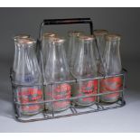 A Metal Eight-Division Milk Crate and Selection of Glass Milk Bottles, the crate with oxidised