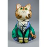 Joan and David De Bethel - Papier mache seated figure of a cat wearing green jacket and waistcoat,