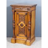 A Late Victorian Oak Cabinet in the Pugin Manner, with leaf carved moulded edge to top, frieze