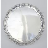 A 20th Century Continental "Sterling" Silver Circular Salver, with shaped and moulded rim, 12ins