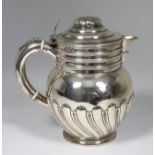 A Late Victorian Silver Bulbous Lidded Jug, by Thomas Bradbury & Sons, London 1900, with stepped