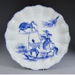 A Limoges Blue and White Porcelain Part Dessert Service with shell pattern borders, outside