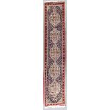 A Bidjar Runner, Mid 20th Century, woven in colours, the field filled with harati design and a