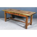 An 18th Century French Provincial Elm and Brass Edged Farmhouse Table, with figured one-plank top