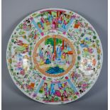A Chinese Cantonese Porcelain Circular Charger, 19th Century, enamelled in colours and gilt with