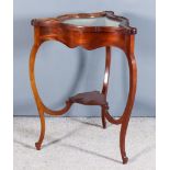 A Late Victorian Mahogany Triangular Shaped Display Table, the lifting top with C-scroll mouldings