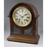 An Early 20th Century German Mahogany Cased Mantel Clock, the 5ins diameter silvered dial with Roman