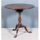 A George III Mahogany Circular Tripod Table, the plain one-piece top on bird cage and turned central
