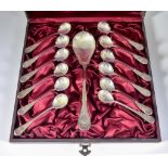 A set of Twelve Continental Silvery Metal Coffee Spoons and Matching Larger Spoon, the handles