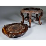 A Chinese Circular Hardwood Stand, supported on five legs, the rim carved in shallow relief with