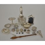 An Elizabeth II Cast Silver Dog House Entrance Pattern Photograph Frame, and mixed silverware, the