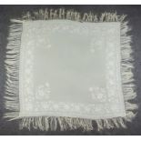 A Chinese Cream Silk Shawl, the border embroidered with flowering sprays, 54ins square excluding