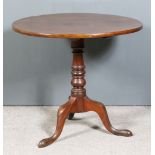 A George III Mahogany Circular Tripod Table, on turned central column and cabriole legs with pad