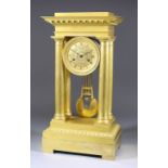 A 19th Century French Empire Gilt Brass Cased Mantel Clock, the 3.625ins diameter gilt dial with