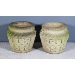 A Pair of Composition Stone Garden Urns, with moulded exteriors and relief handles and with flared