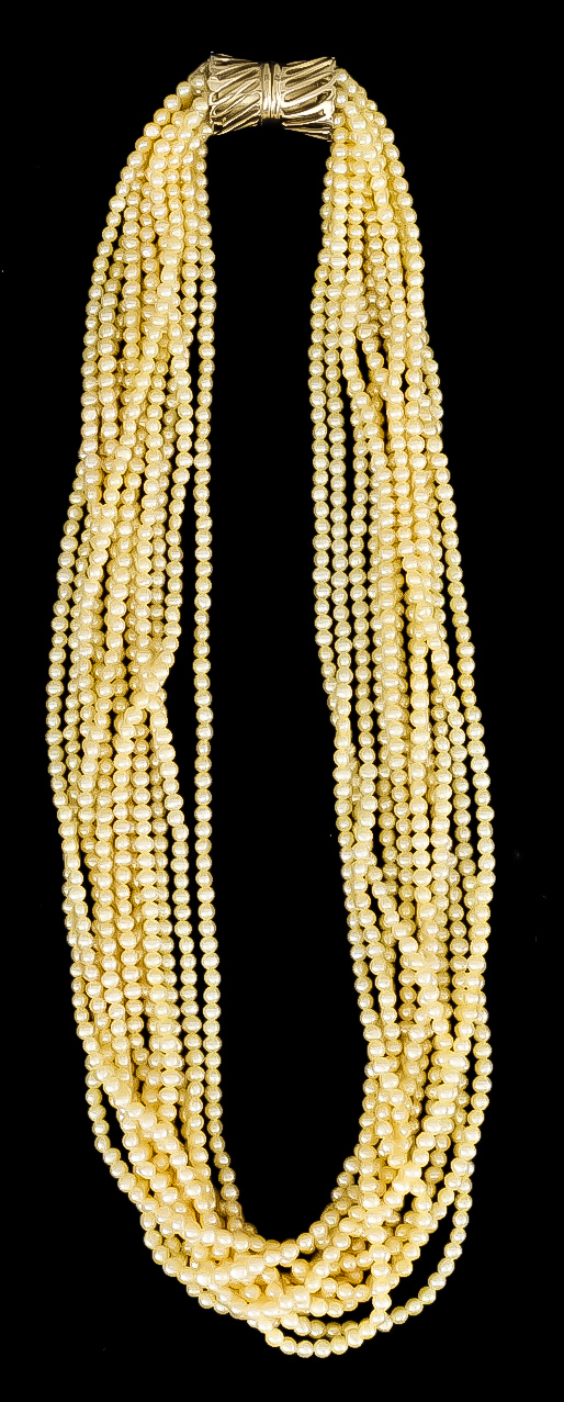 A Multi Strand Pearl Choker Necklace, 20th Century, comprising eleven intertwined strands of