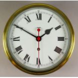 A 20th Century Brass Finished Cased Bulkhead Clock by F.W. Elliott Ltd. the 8ins diameter painted