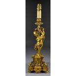An Early 20th Century French Gilt Brass Electric Table Lamp, the column moulded with a standing