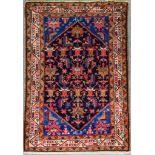 A Bakhtiari Rug, Late 19th/Early 20th Century, woven in colours with a central trellis design filled