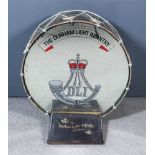 A Durham Light Infantry Base Drum, adapted as a coffee table, with bugle motif to mirrored table top