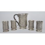 A Near Eastern Silvery Metal Baluster Shaped Lemonade Set, with plain rims, the bodies embossed