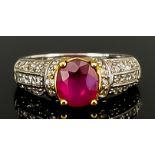 A Ruby and Diamond Ring, Modern, in 14ct white gold mount, set with a central faceted ruby,