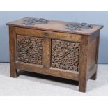A 20th Century Panelled Oak Coffer in the Arts and Crafts Manner, the plain lifting lid with
