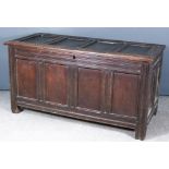 A 17th Century Panelled Oak Coffer, with four panel lid and front, the whole with moulded rails,with