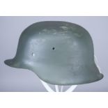 A German World War II Helmet, painted, no liner