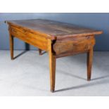 A 19th Century French Fruitwood and Elm Kitchen Table, the plain three-plank top with cleated ends