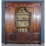 An 18th Century Continental Panelled Ash Cabinet, with moulded cornice, frieze carved with cross and
