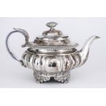 A George III Silver Teapot, by Samuel Brookes, London 1822,the squat circular body panelled and with