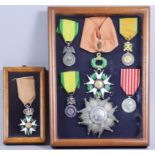 A Framed Group of Eight French Honours and Awards, seven are in one frame and one is single