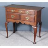 A Mid 18th Century Oak Lowboy, the plain top with narrow moulded edge, fitted one long frieze drawer