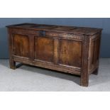 A 17th Century Panelled Oak Coffer, with four panel top and three panel front, with moulded and