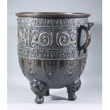 A Chinese Bronze Basin, standing on three lion feet, modelled with archaic motifs, and with gilt and