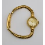 A Lady's Omega Manual Wind Wristwatch, 1960's, 9ct Gold Cased, 20mm diameter, the champagne dial