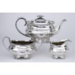 A George IV Silver Three-Piece Tea Service, by Hyam Hyams, London 1821, the rectangular partly