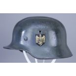 A German World War II Helmet, painted, with double decals