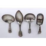 A George III Plain Silver Caddy Spoon and Three Other Silver Caddy Spoons, the George III spoon,