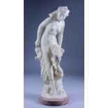 A Continental Carved Alabaster Figure of the Naked Venus, Late 19th Century leaning on a rocky
