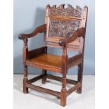 An Oak Armchair of "17th Century" North Country Design, the shaped crest rail and panel to back