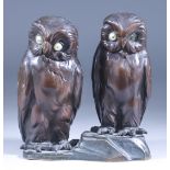 A Brown Patinated Bronze Group, 20th Century - Two owls with pearl eyes (one missing), 5.5ins high
